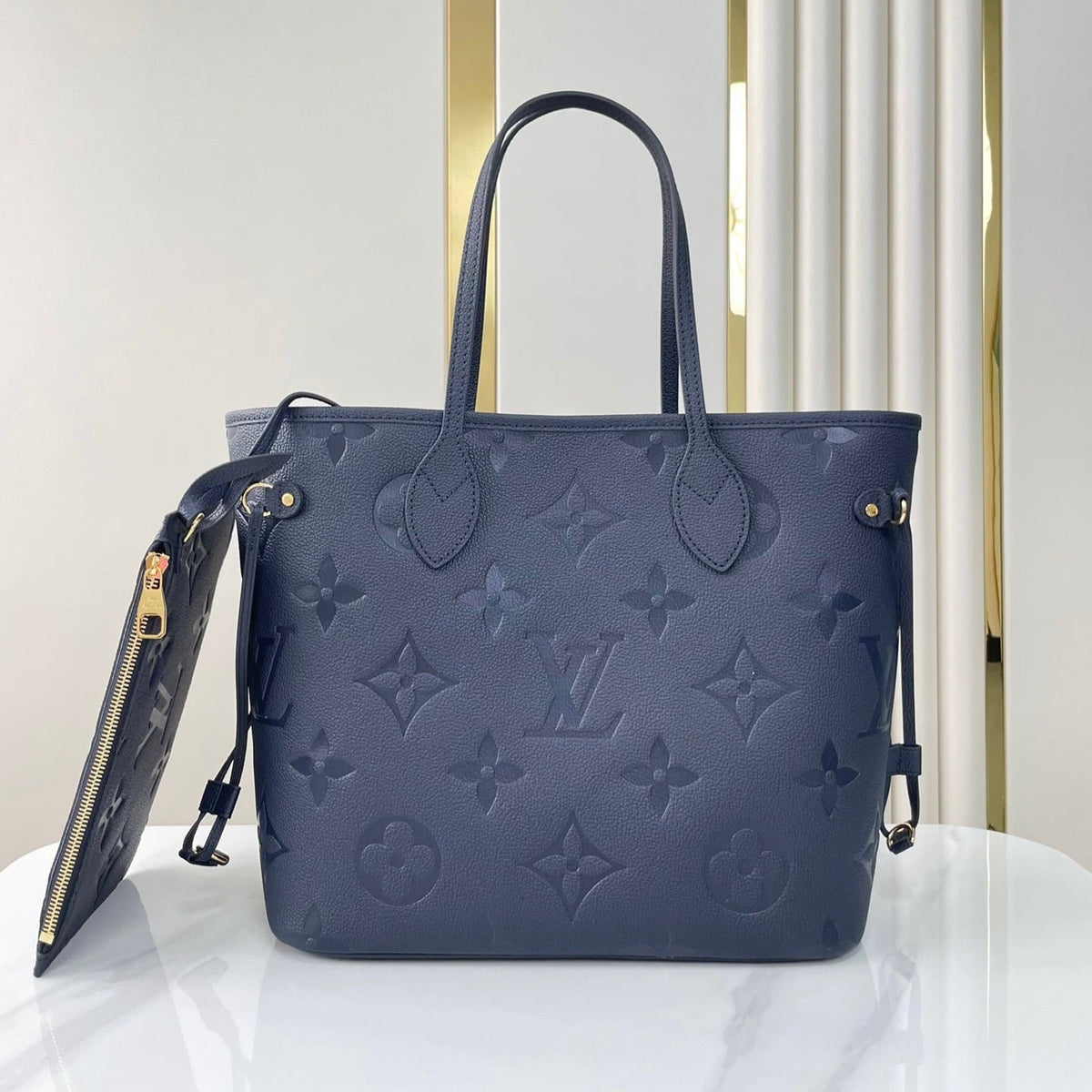 LOUIS VUITTON NEVERFULL MM 31 IN DARK NAVY MONOGRAM EMPREINTE LEATHER